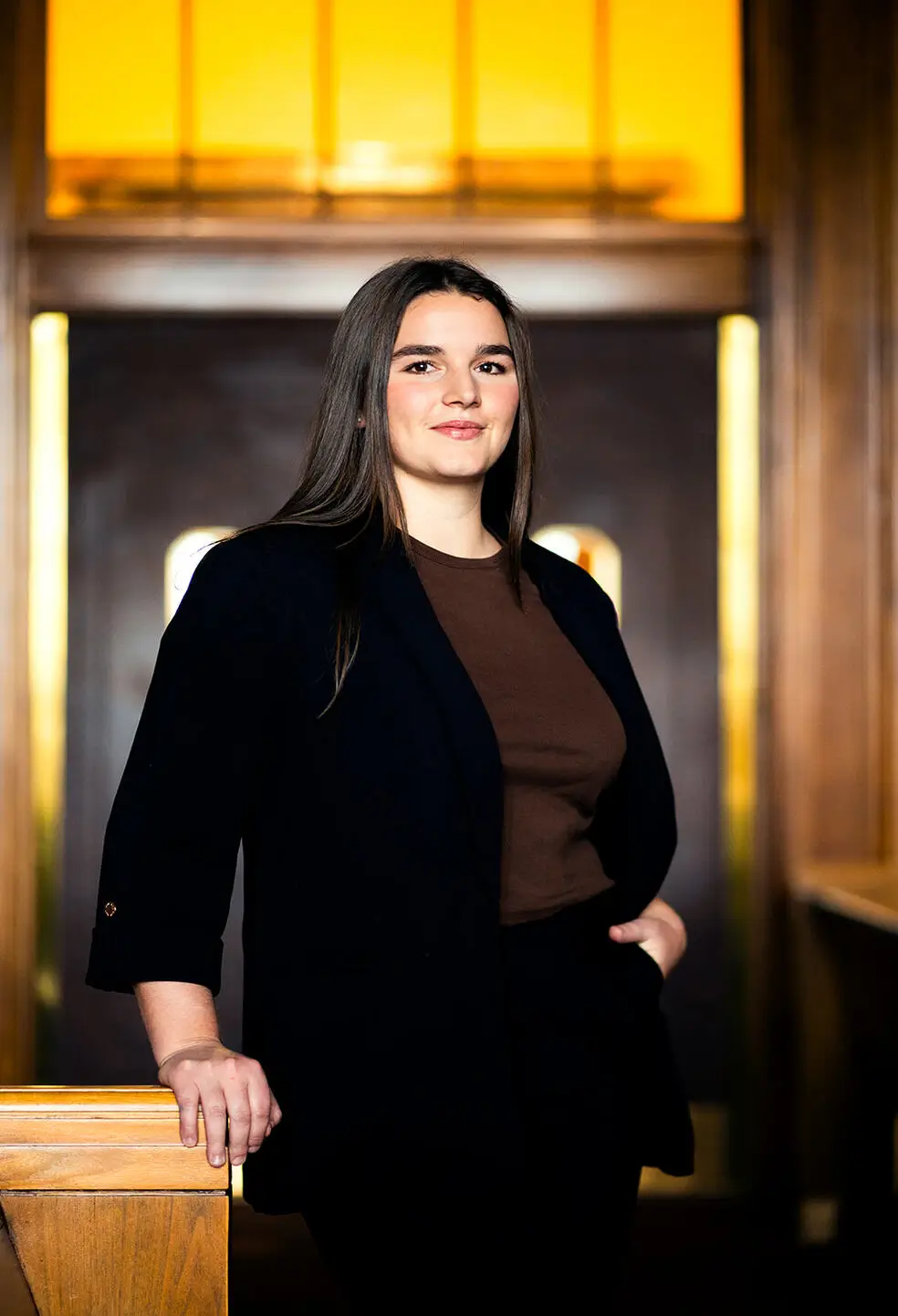 a woman standing in front of a door