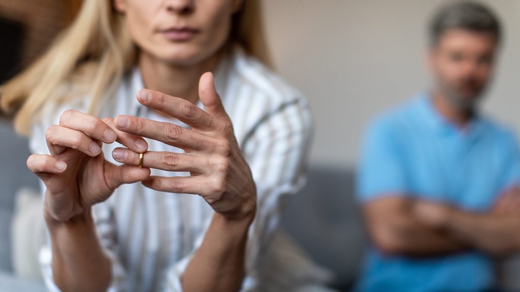 Unhappy lady takes off ring