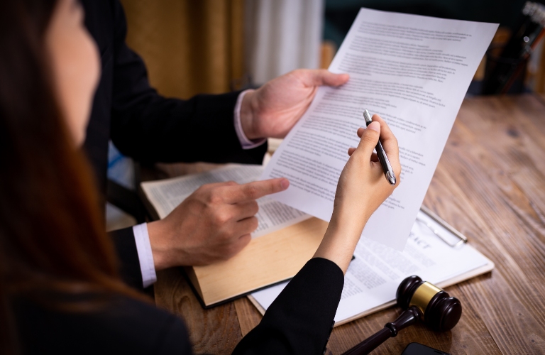 lawyer goes through documents with client